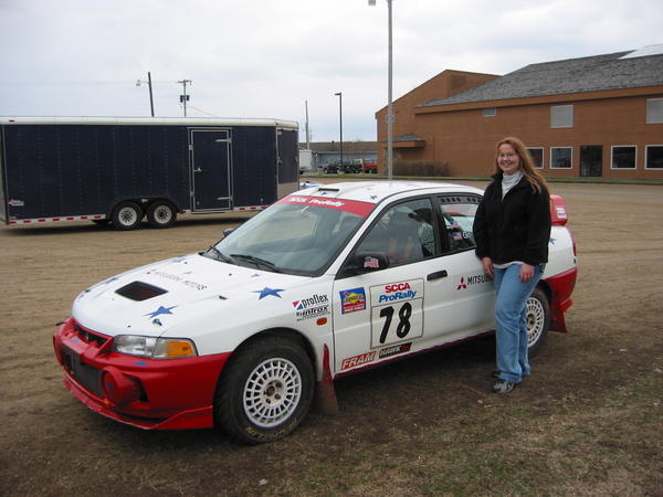 Melissa Gaugert poses next to an EVO at Headwaters 2002
